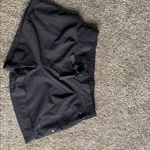 Dark gray athletic shorts with drawstring